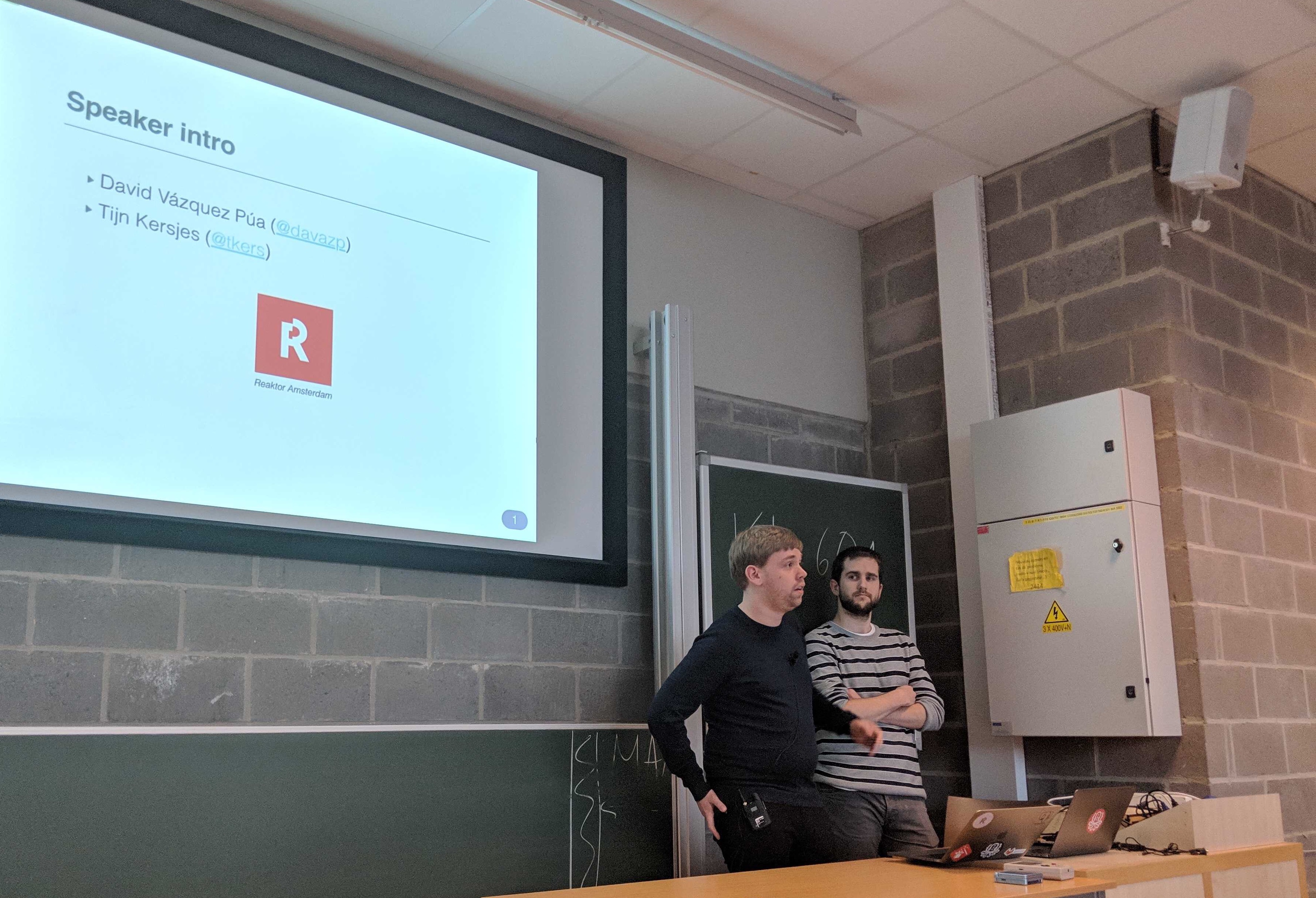 A photo of Tijn and David doing a conference talk