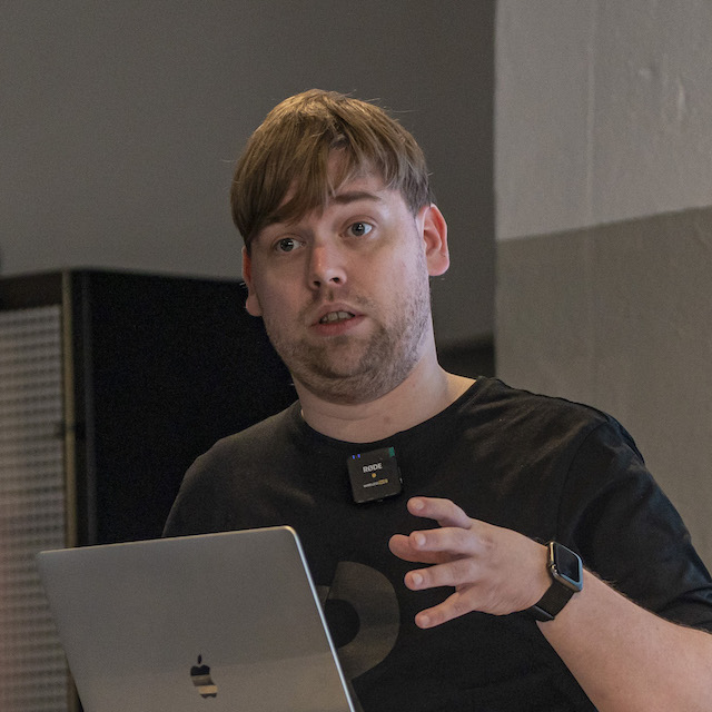 A picture of me speaking at GambiConf 2022
